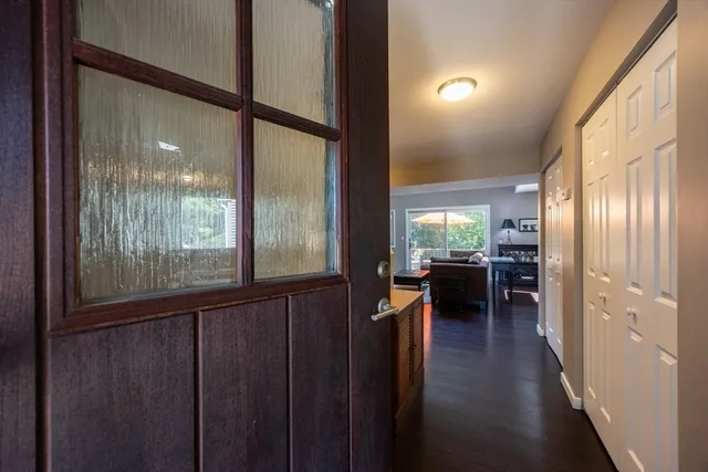 a dining room with wooden floor and a table