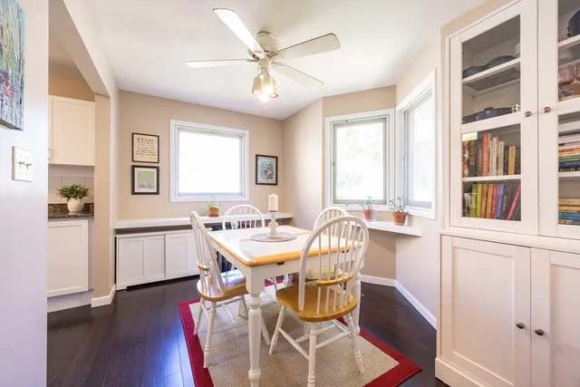 a view of a dining room with furniture window and wooden floor