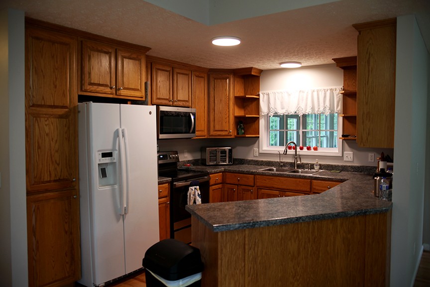 1047 Mooneyhan Road Springfield, TN 37172 - Photo 16 of 29 a kitchen with granite countertop stainless steel appliances a refrigerator a sink a stove cabinets and a counter top space