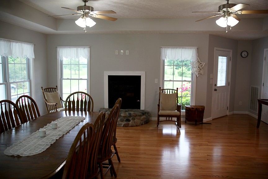1047 Mooneyhan Road Springfield, TN 37172 - Photo 18 of 29 a view of a dining room with furniture window and wooden floor