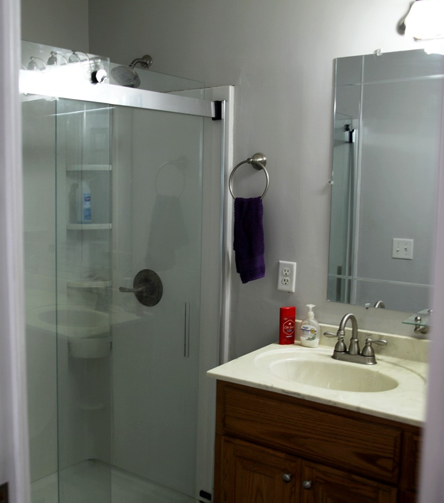 1047 Mooneyhan Road Springfield, TN 37172 - Photo 24 of 29 a bathroom with a sink vanity and shower