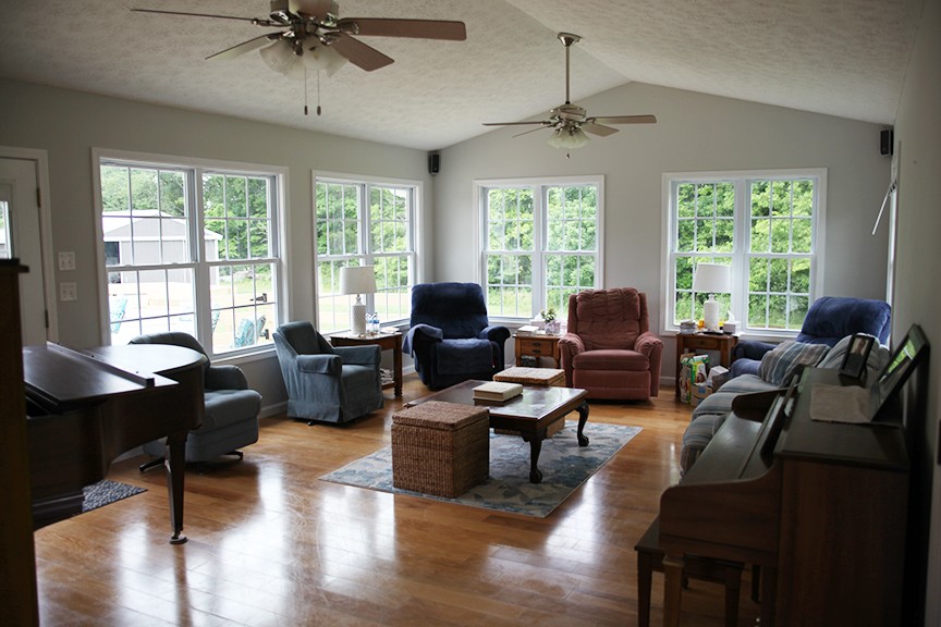 1047 Mooneyhan Road Springfield, TN 37172 - Photo 26 of 29 a living room with furniture a large window and a chandelier