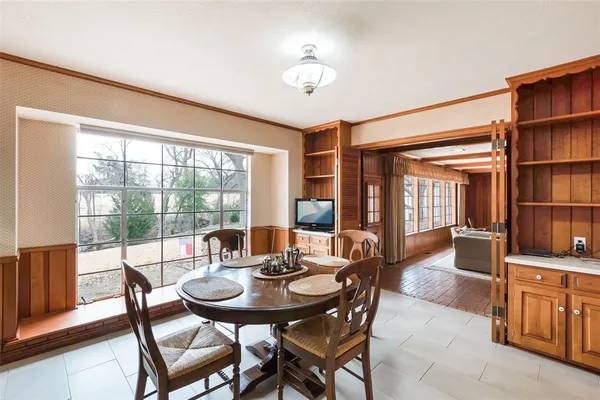 a view of a dining room with furniture window and outside view