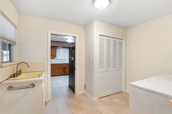 a bathroom with a sink a toilet and tub