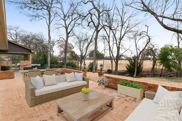 a view of a patio with couches and a fire pit