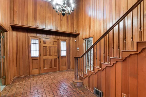 a view of an entryway with wooden floor