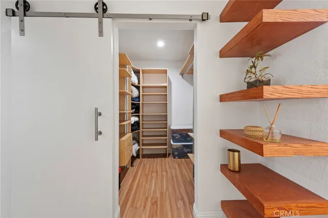 a view of a room with stairs and wooden floor