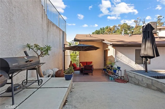 a view of a patio with table and chairs