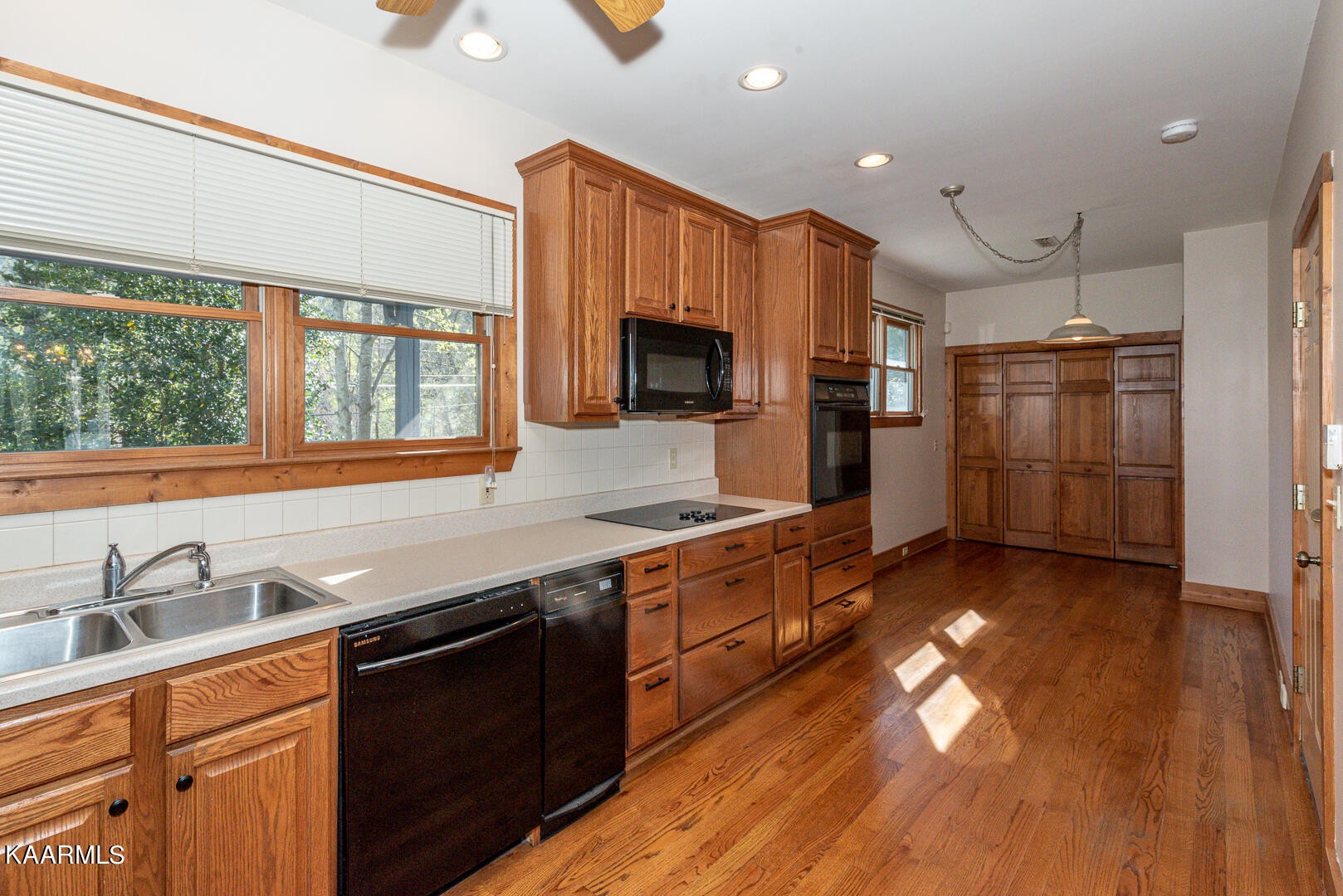 444 Laurel Road Townsend, TN 37882 - Photo 18 of 55 a kitchen with stainless steel appliances granite countertop a sink stove and refrigerator