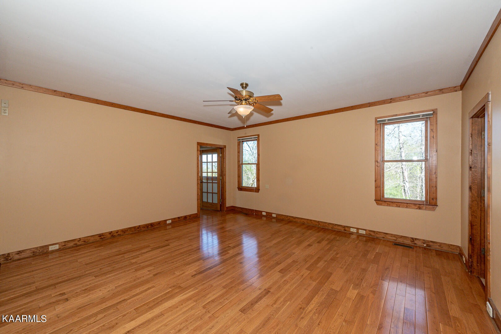 444 Laurel Road Townsend, TN 37882 - Photo 20 of 55 an empty room with wooden floor and windows