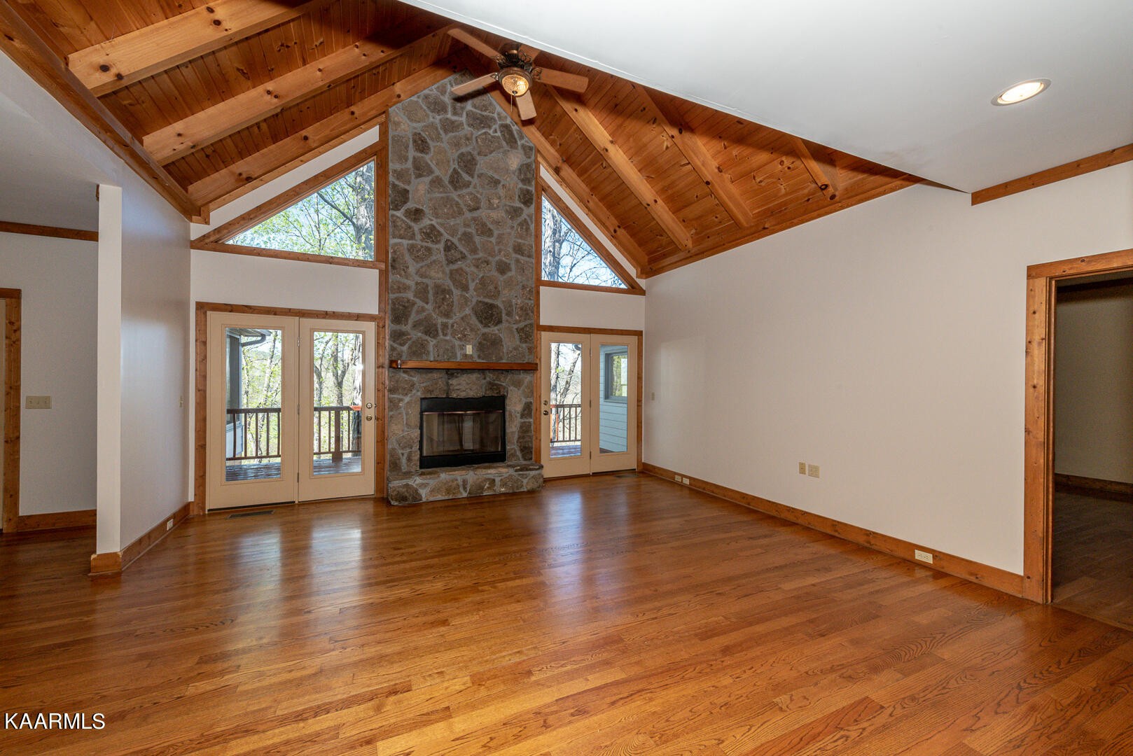 444 Laurel Road Townsend, TN 37882 - Photo 10 of 55 a view of empty room with wooden floor and fireplace