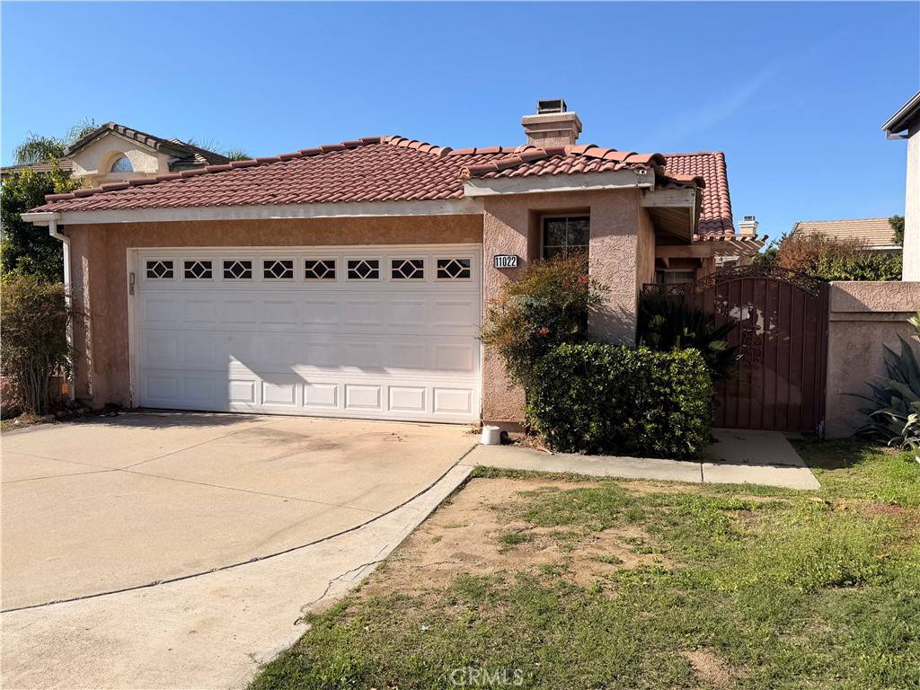 11022 Carlow Court Rancho Cucamonga, CA 91701 - Photo 2 of 4 a view of a house with a garage