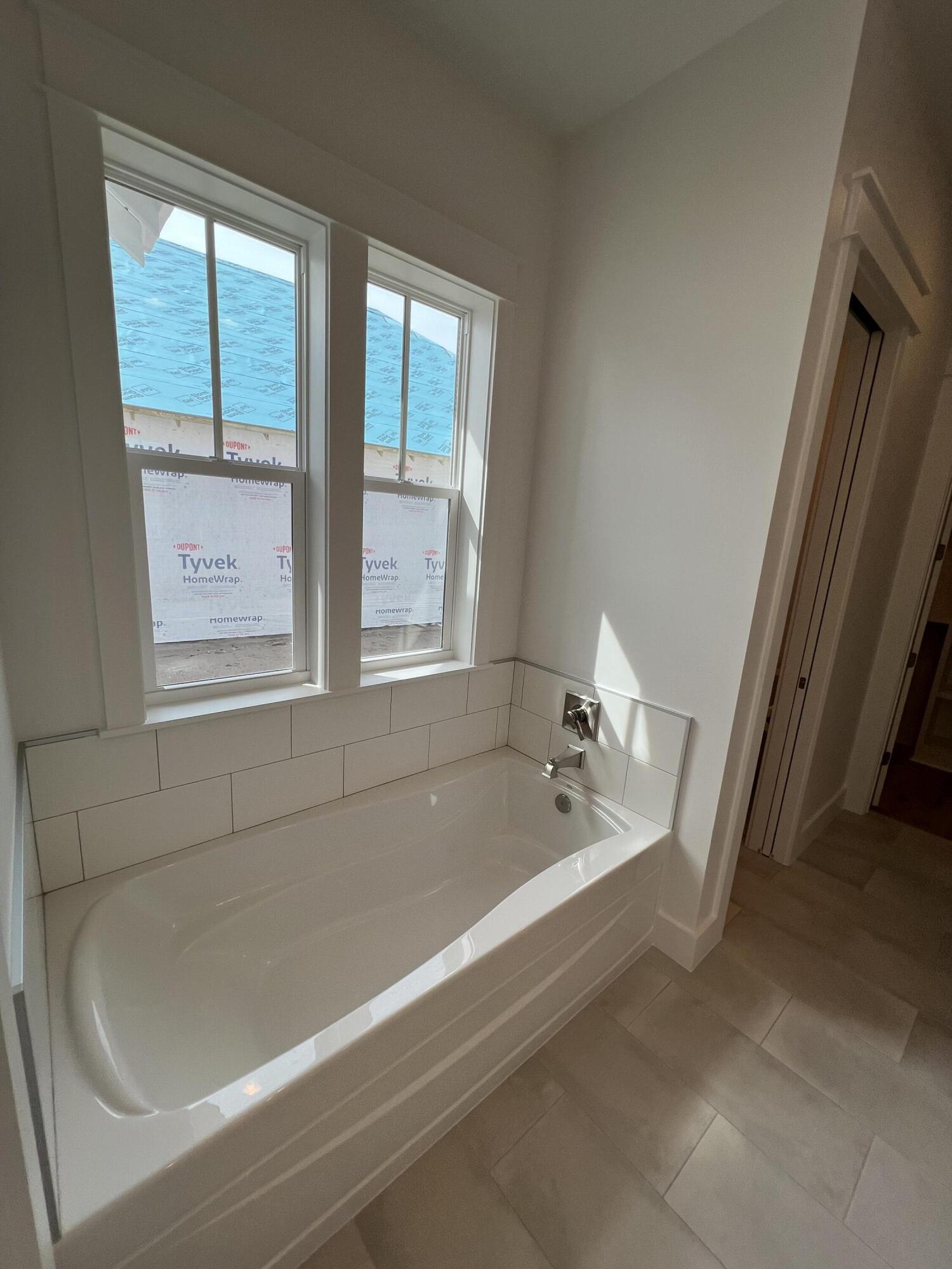 108 Sidecamp Road Watersound, FL 32461 - Photo 15 of 36 a bath tub sitting next to a window