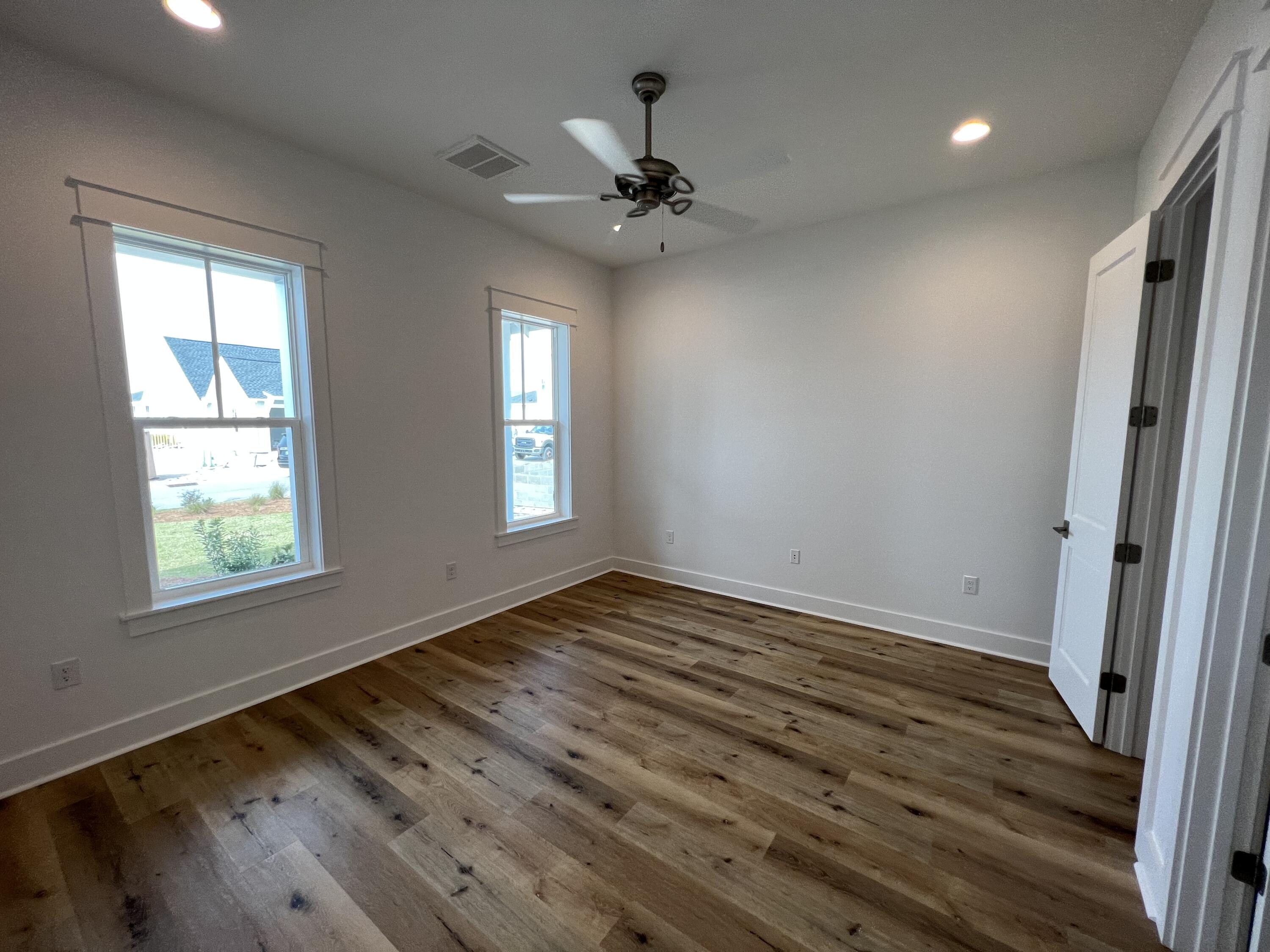 108 Sidecamp Road Watersound, FL 32461 - Photo 18 of 36 wooden floor in an empty room with a window