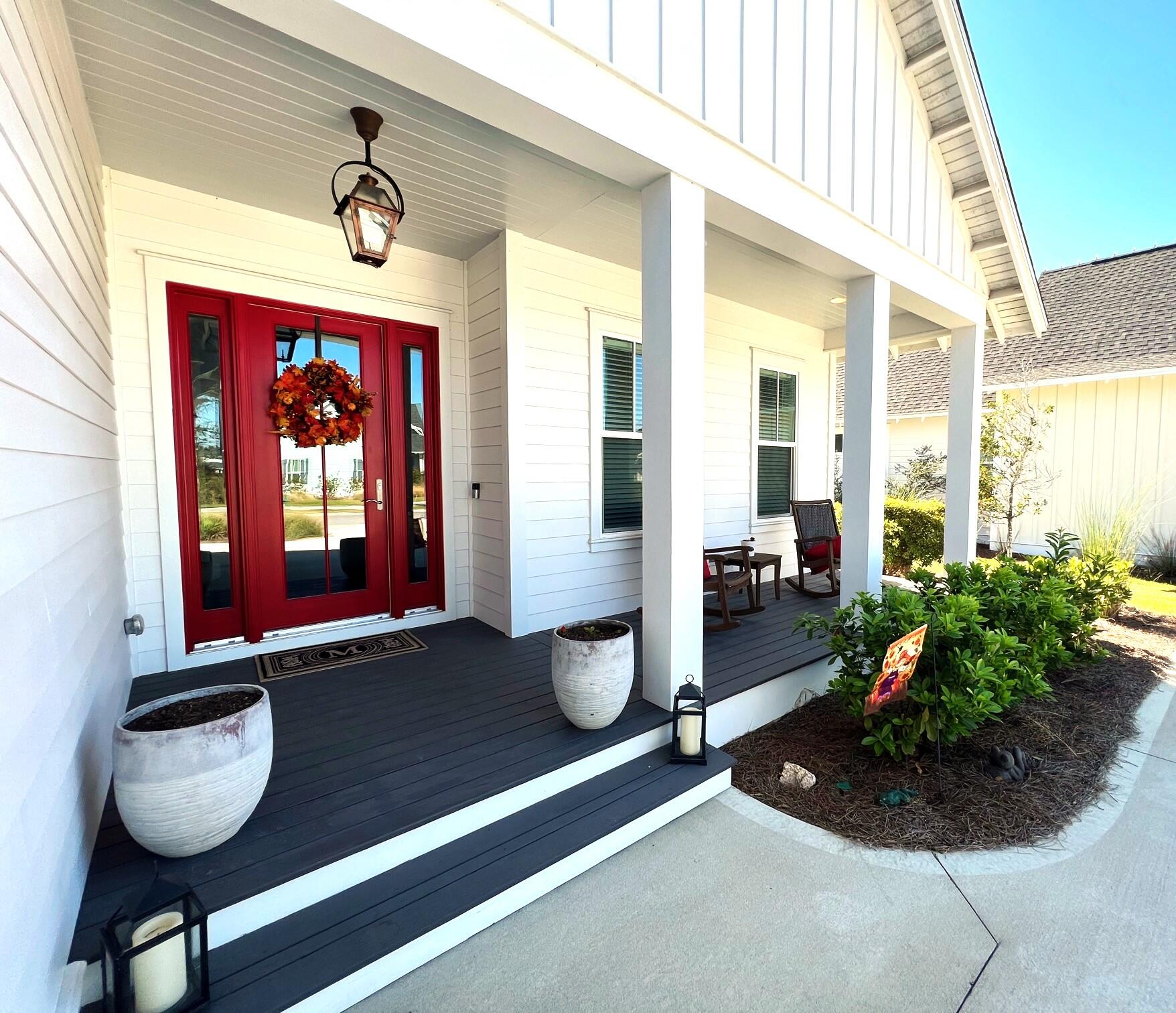 108 Sidecamp Road Watersound, FL 32461 - Photo 2 of 36 a living room with furniture and a potted plant