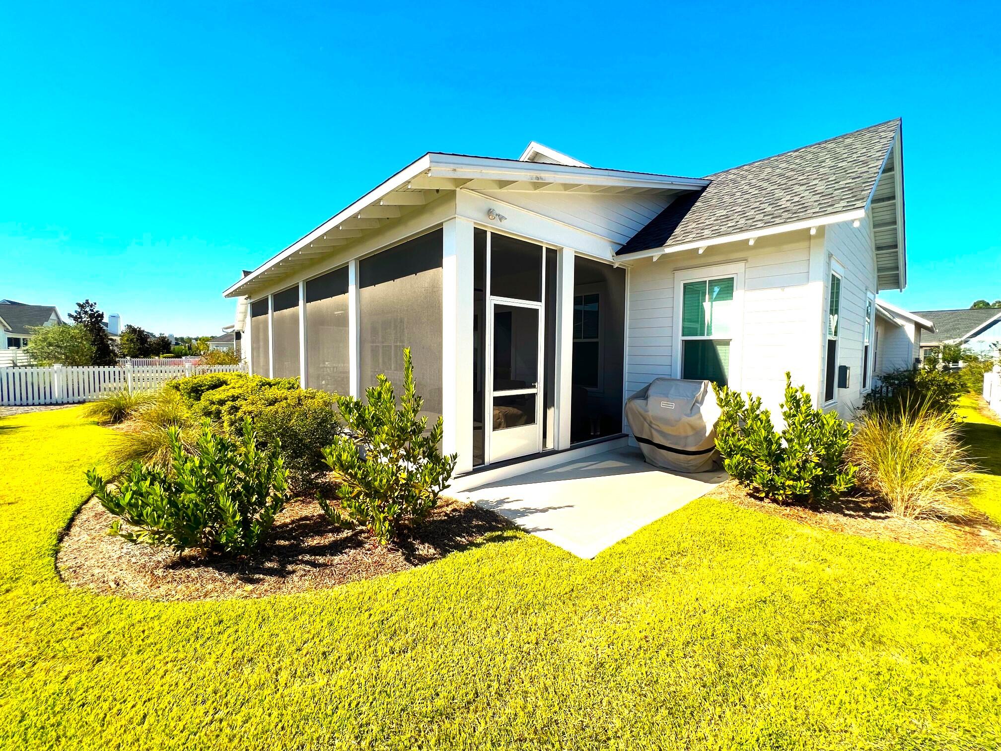 108 Sidecamp Road Watersound, FL 32461 - Photo 30 of 36 a view of a house with pool and sitting area