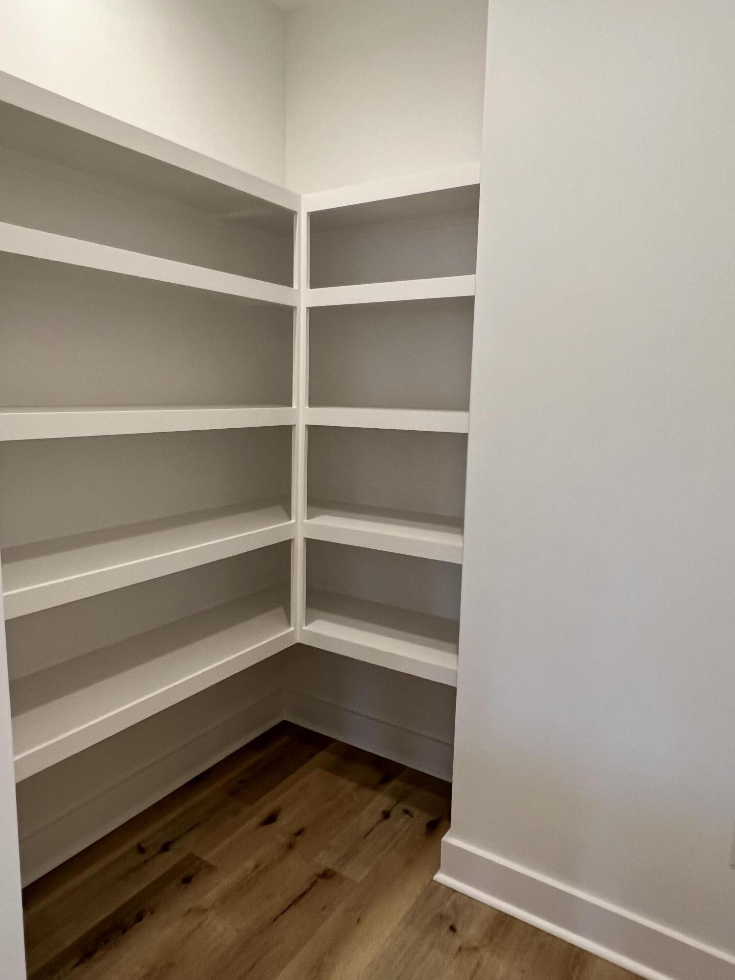 108 Sidecamp Road Watersound, FL 32461 - Photo 7 of 36 a view of walk in closet with empty racks