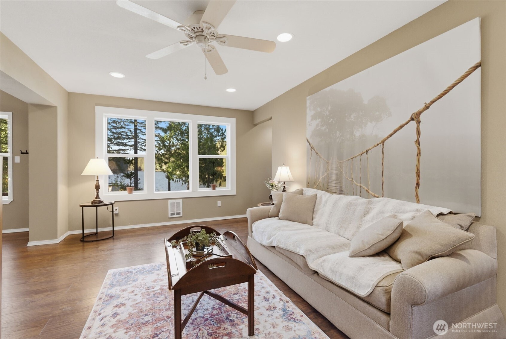 6971 Northeast Tahuya Blacksmith Road Belfair, WA 98528 - Photo 7 of 38 a living room with furniture and a large window