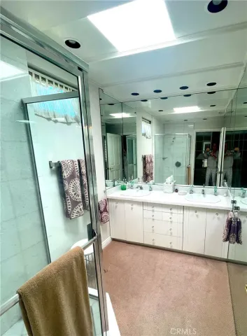 a large white tub sitting in a kitchen and a large window