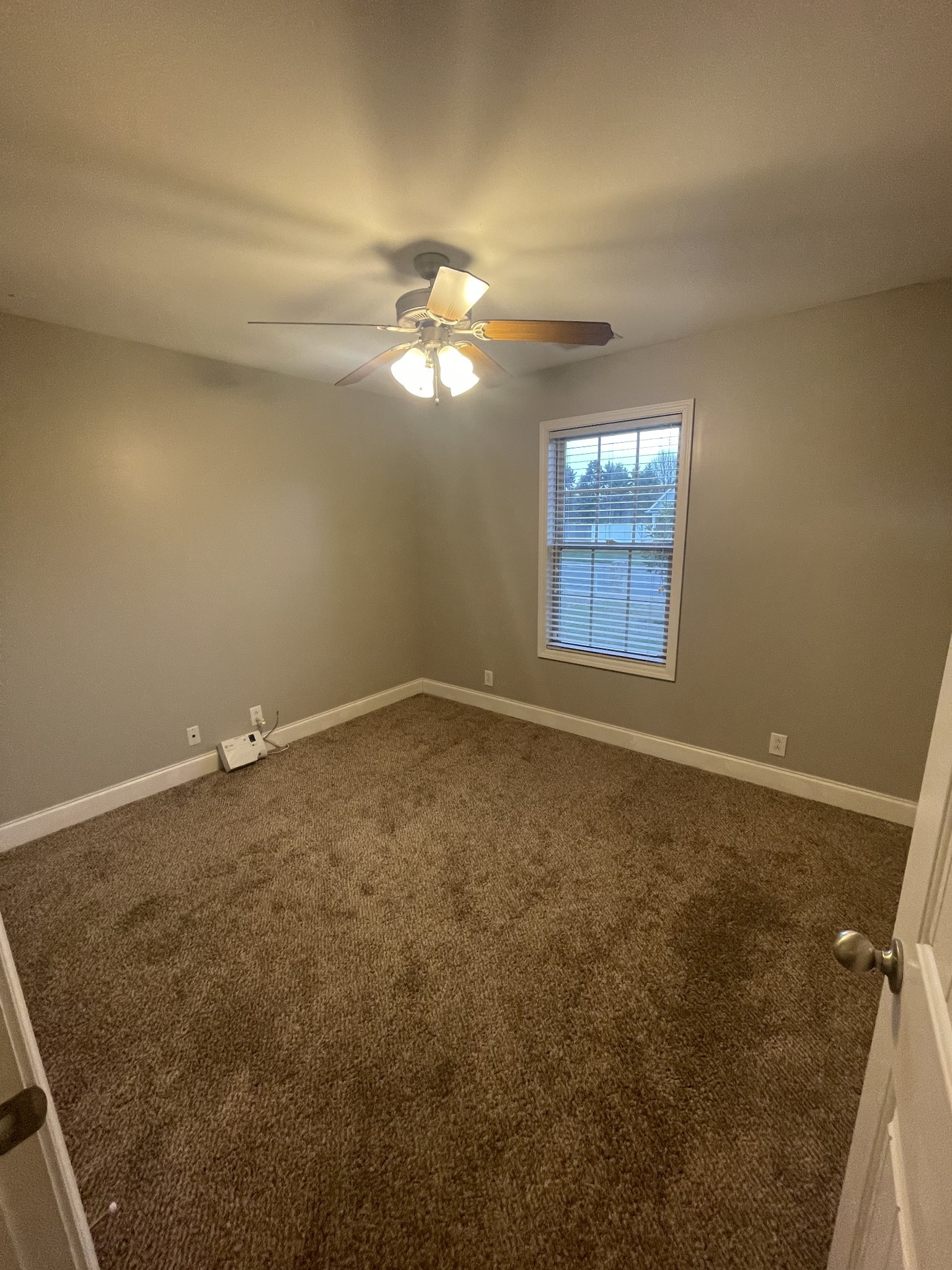 4815 Conquer Drive Murfreesboro, TN 37128 - Photo 9 of 10 an empty room with windows and fan