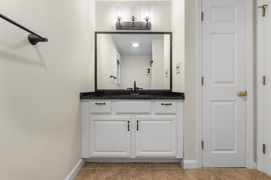 13 Plain Street Upton, MA 01568 - Photo 15 of 27 a close view of a stove in the kitchen