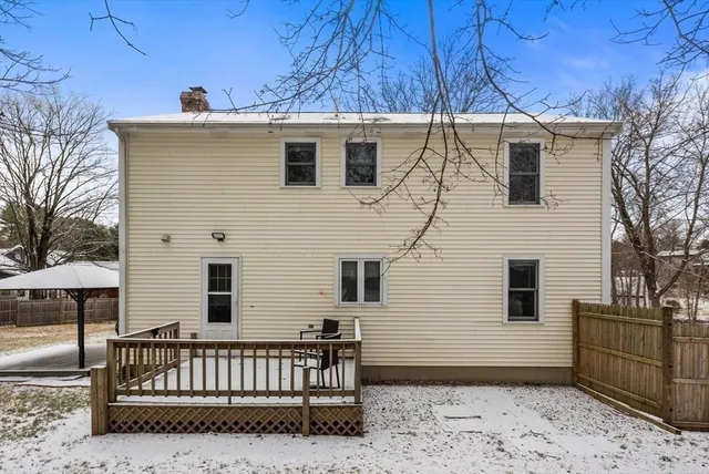 a view of a house with a backyard