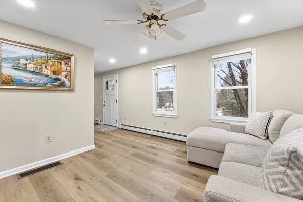 a living room with furniture and a window