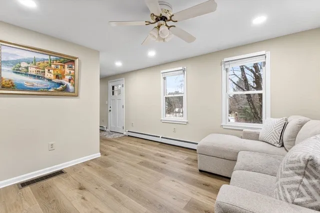 a living room with furniture and a window