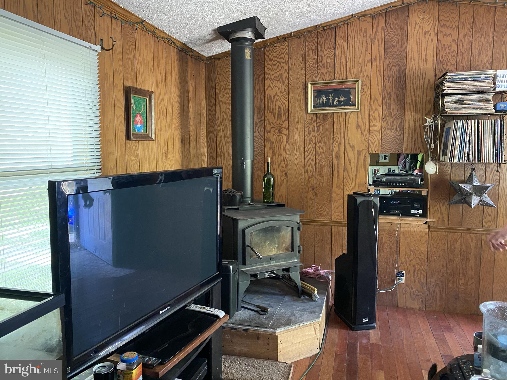 12845 Old Furnace Road Georgetown, DE 19947 - Photo 11 of 17 H/W flooring in LR, woodstove reserved