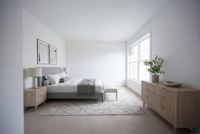 a living room with furniture and flowers