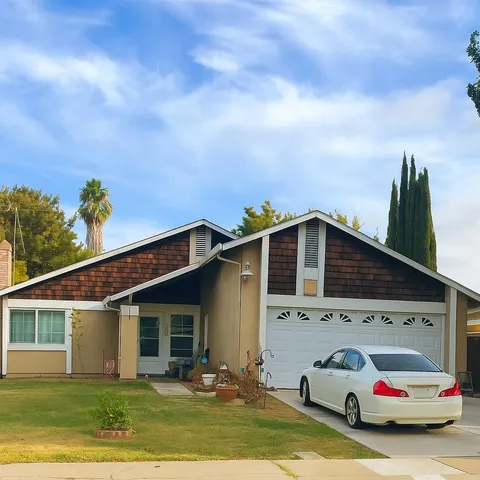 a house view with a garden space