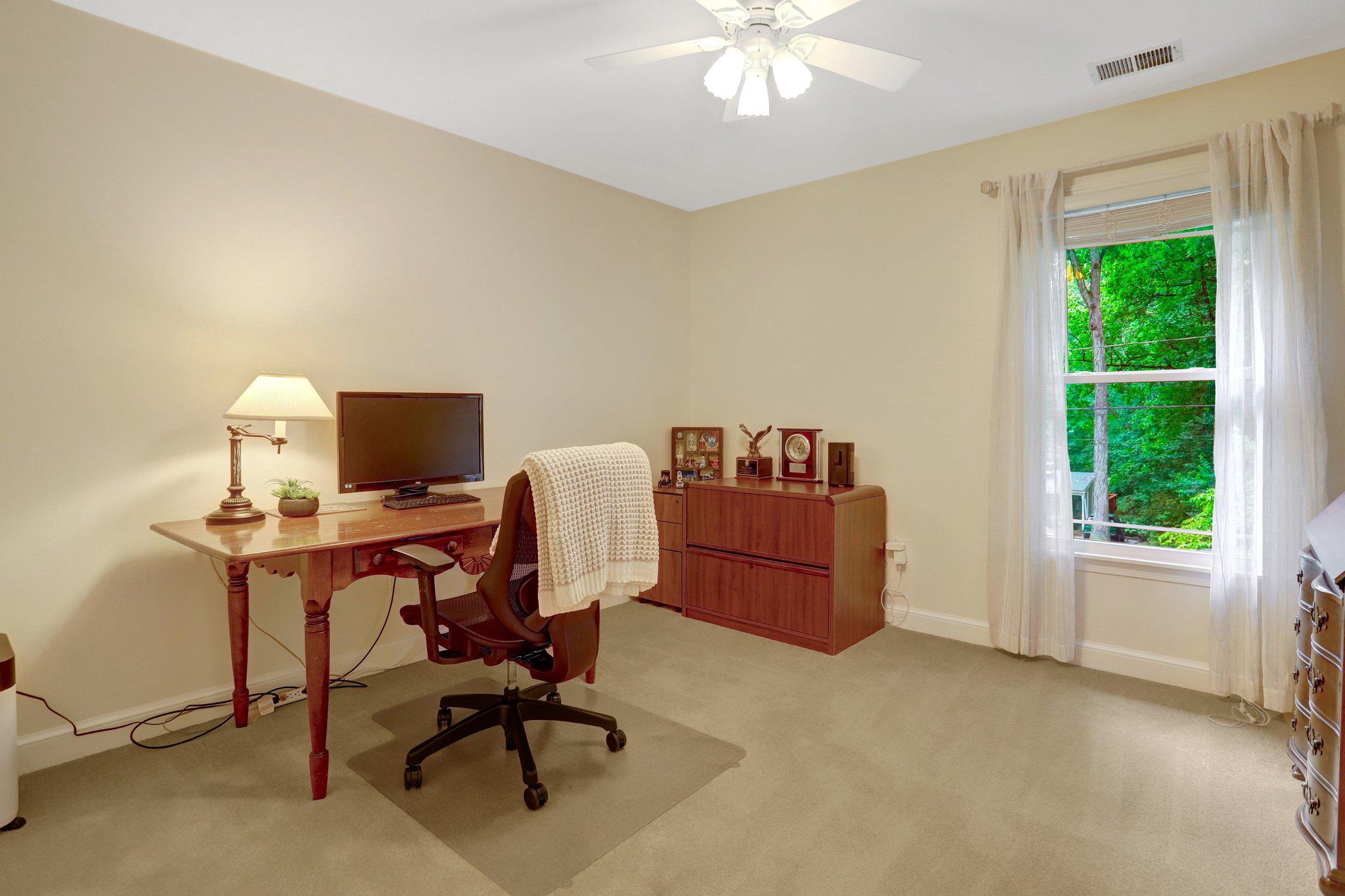 7506 Oriole Avenue Springfield, VA 22150 - Photo 32 of 67 a view of a workspace with furniture and a window