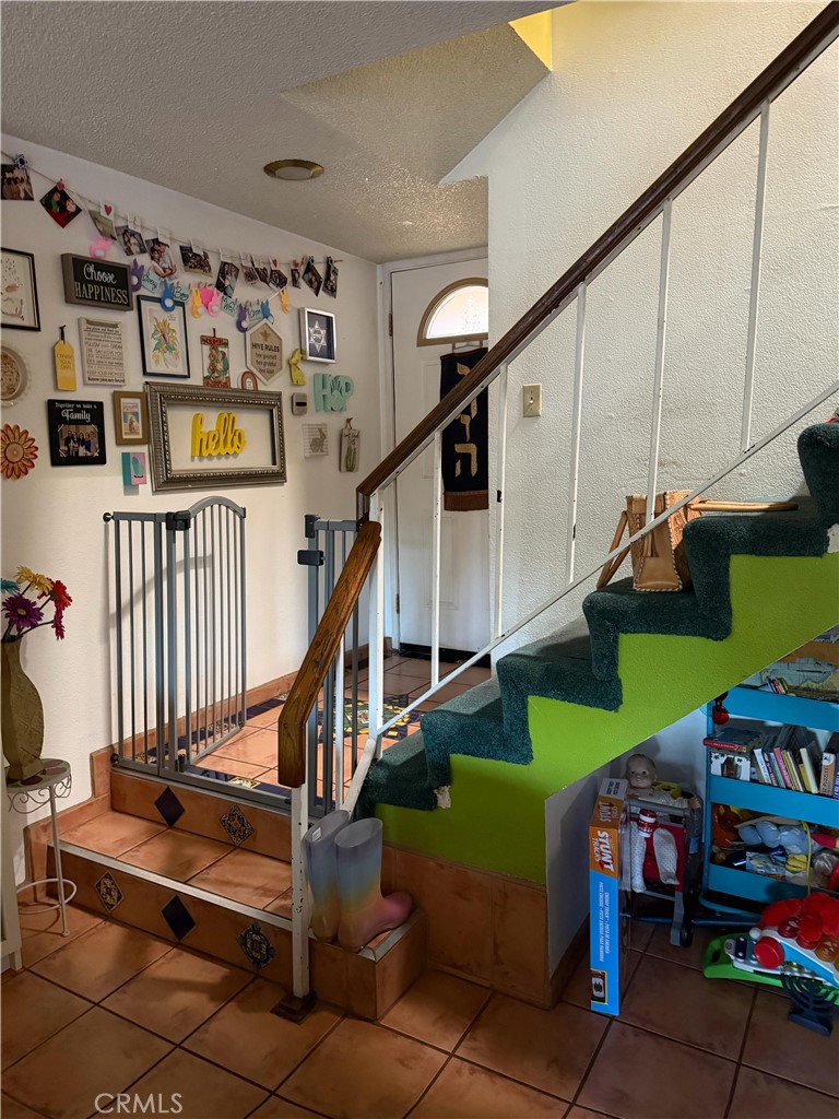 5345 Peck Road, Unit B El Monte, CA 91732 - Photo 4 of 17 a room with lots of white furniture and a wooden floor