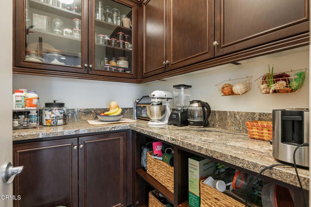 652 Xanadu Way Oxnard, CA 93036 - Photo 15 of 40 a kitchen with stainless steel appliances granite countertop a sink stove and cabinets