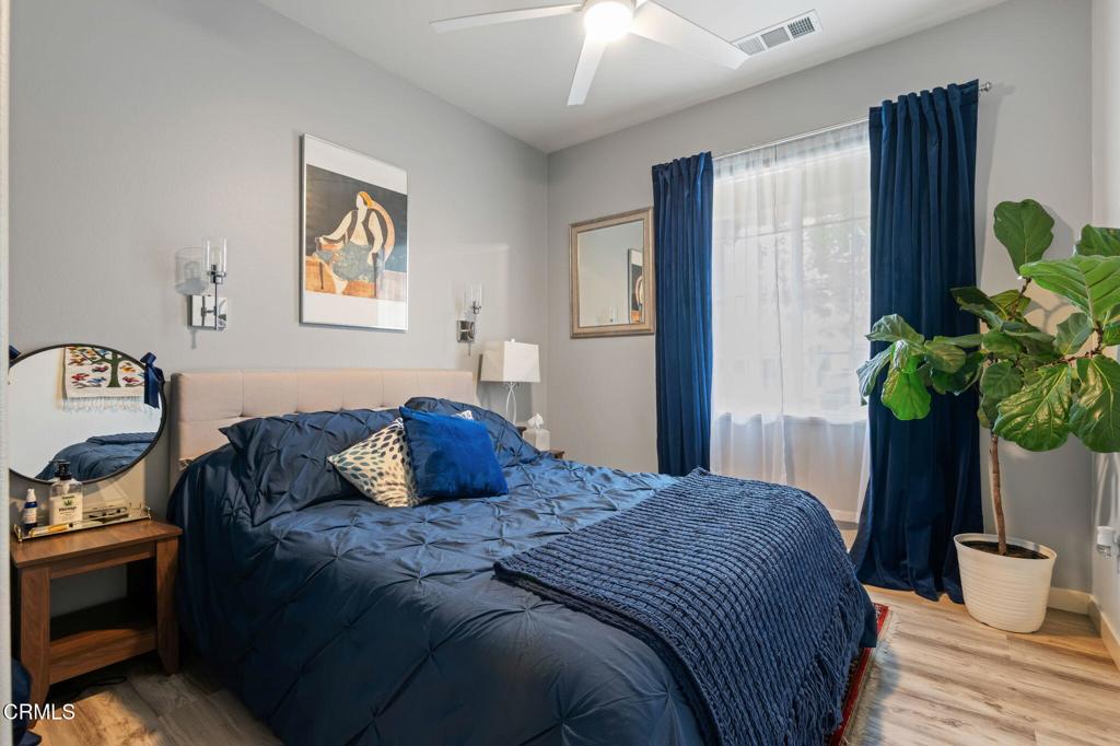 652 Xanadu Way Oxnard, CA 93036 - Photo 16 of 40 a bedroom with a bed and a potted plant