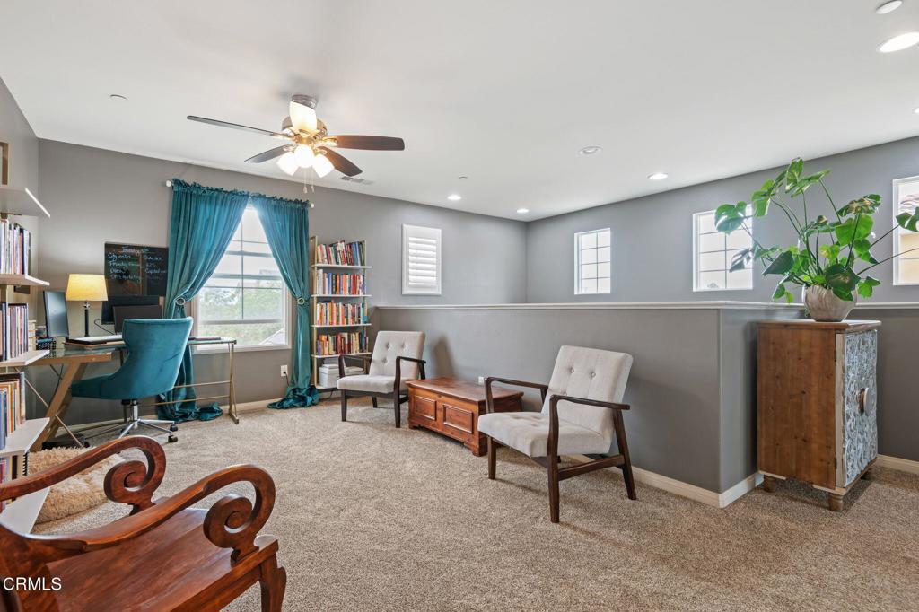 652 Xanadu Way Oxnard, CA 93036 - Photo 18 of 40 a living room with furniture a window and a flat screen tv