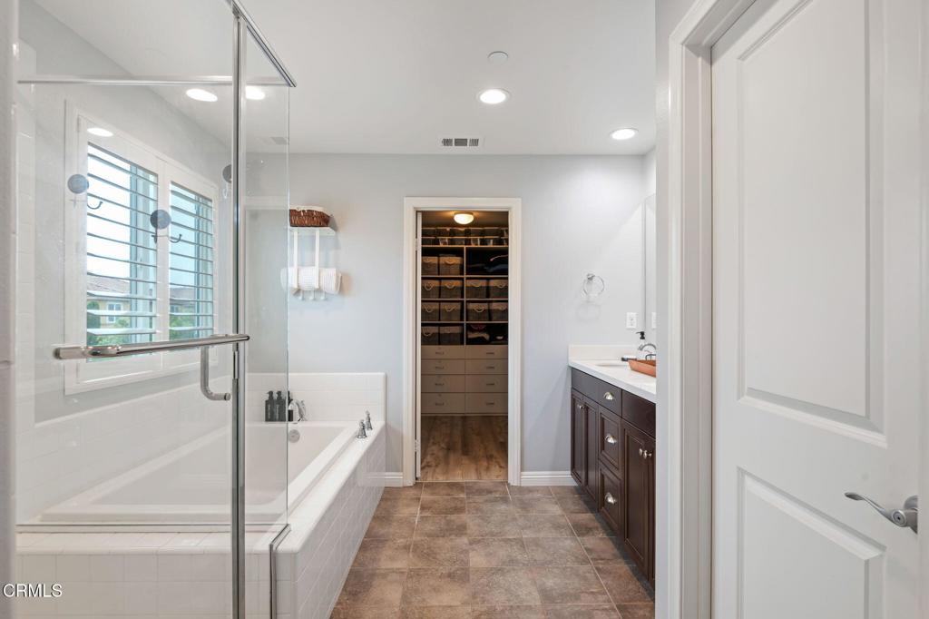652 Xanadu Way Oxnard, CA 93036 - Photo 22 of 40 a bathroom with a bathtub and a shower