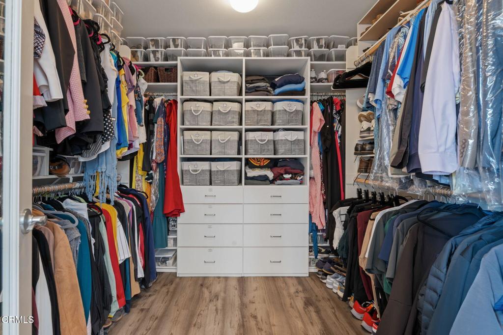 652 Xanadu Way Oxnard, CA 93036 - Photo 25 of 40 a view of walk in closet with clothes and shoes