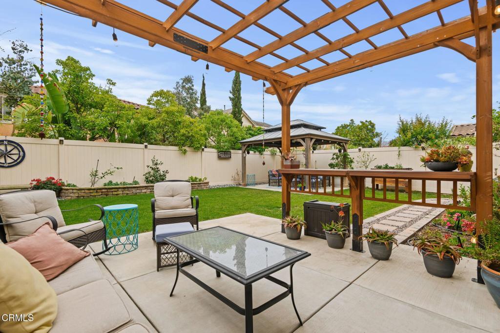 652 Xanadu Way Oxnard, CA 93036 - Photo 30 of 40 a view of a terrace with furniture and a backyard