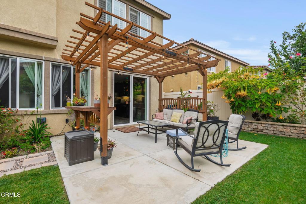 652 Xanadu Way Oxnard, CA 93036 - Photo 31 of 40 a view of a patio with table and chairs and potted plants
