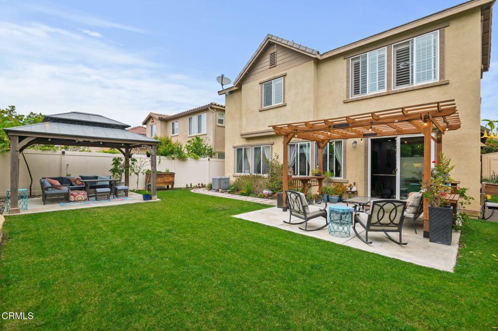 652 Xanadu Way Oxnard, CA 93036 - Photo 32 of 40 a view of a patio with table and chairs and potted plants