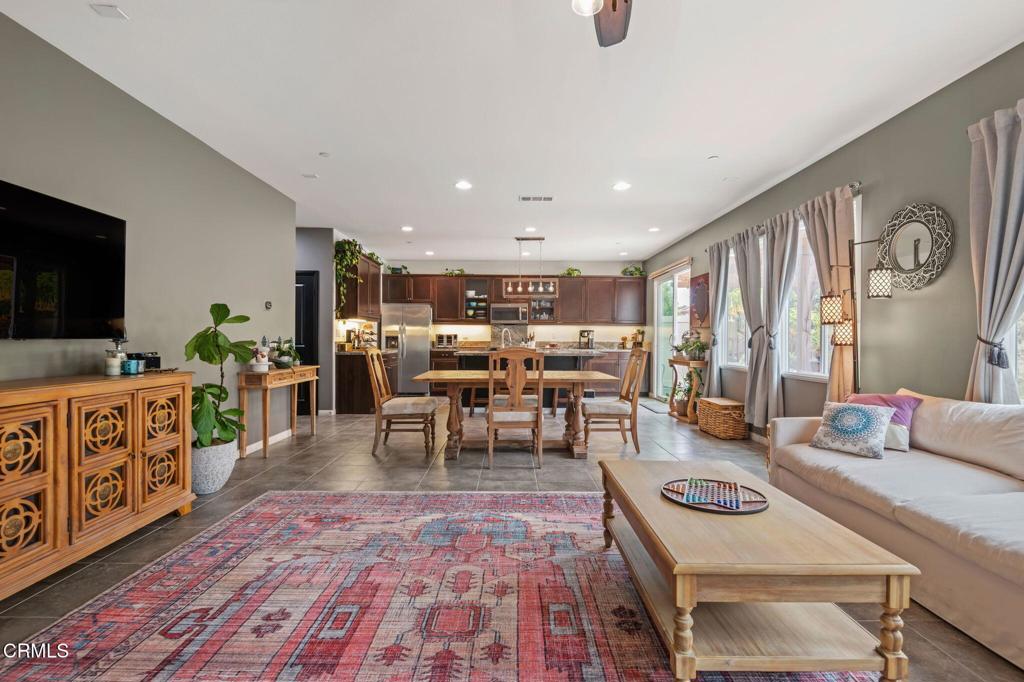 652 Xanadu Way Oxnard, CA 93036 - Photo 8 of 40 a living room with furniture a rug and a flat screen tv