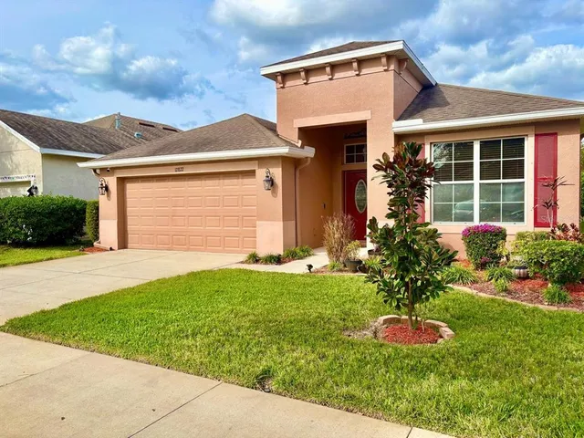 a front view of house with yard and outdoor seating