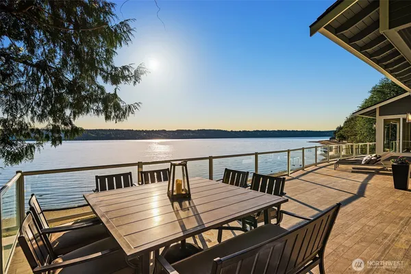 a view of a balcony dining area with furniture