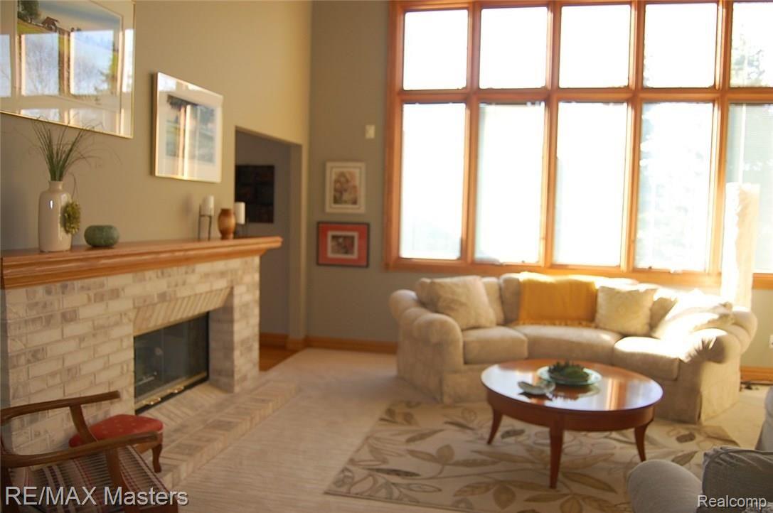 4215 Brest Road Newport, MI 48166 - Photo 11 of 33 Living Room with 2-Sided Gas Fireplace