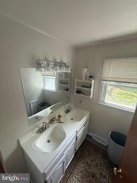 12601 Livingston Road Fort Washington, MD 20744 - Photo 14 of 26 a en suite bathroom with a double vanity sink and a mirror