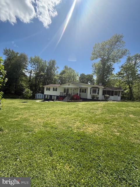 12601 Livingston Road Fort Washington, MD 20744 - Photo 25 of 26 a view of house with swimming pool outdoor seating and green space