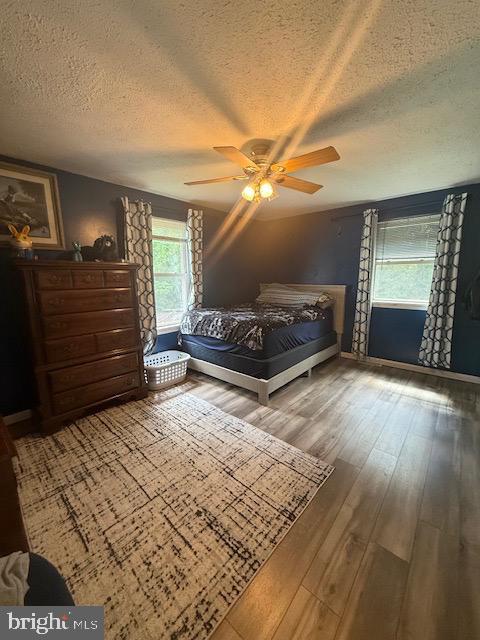 12601 Livingston Road Fort Washington, MD 20744 - Photo 10 of 26 a bedroom with a bed and a chandelier