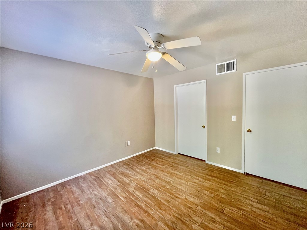 7885 West Flamingo Road, Unit 1029 Las Vegas, NV 89147 - Photo 12 of 18 Well-lit room featuring durable flooring and a refreshing ceiling fan for year-round comfort.