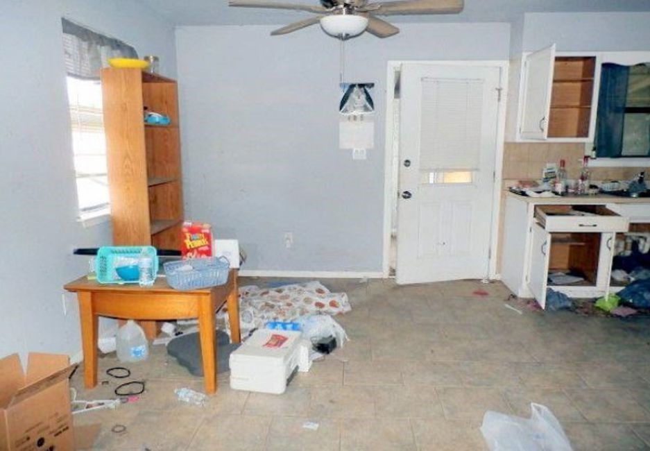 707 First Street Bangs, TX 76823 - Photo 5 of 9 a bed room with a bed and a chandelier